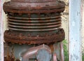 Large eroded connection part of a pipeline in a decommissioned factory