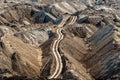 Large excavation site with roads ahead