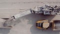 Large excavator in a lignite coal mine. Loading coal into truck. Mining car machinery to transport coal. Open pit mine