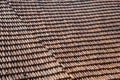 A large expanse of sagging rustic French roof tiles