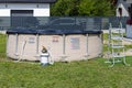 Large expansion pool with a diameter of 3.96 meters, set in the backyard next to the house.