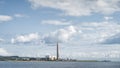 Large factory with tall chimney and industrial harbour on the coast, Carrickfergus town Royalty Free Stock Photo