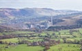 Factory with a tall smoke tower in rural England Royalty Free Stock Photo