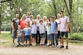 Large family with cousin grandparent father and kid on a forest