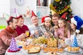 Large family eating Christmas dinner