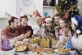 Large family eating together during festive Christmas dinner Royalty Free Stock Photo