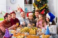 Large family eating together during festive Christmas dinner Royalty Free Stock Photo