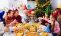 Large family eating together during festive Christmas dinner