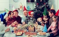 Large family eating together during festive Christmas dinner Royalty Free Stock Photo