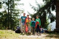Large family with four kids resting in mountains. Travel and hiking with childrens Royalty Free Stock Photo