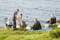 A large family had a picnic on the shore