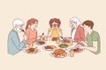 Large family has dinner together after completing religious fast, sitting around table with food Royalty Free Stock Photo