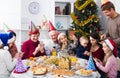 Large family making numerous photos during Christmas dinner Royalty Free Stock Photo