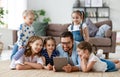 Large family mother, father and children with tablet computer at home Royalty Free Stock Photo