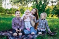 Large family. Mother and three children in the Park. Family outdoor recreation Royalty Free Stock Photo