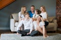 Large family several generations with children relaxing on couch in living Royalty Free Stock Photo