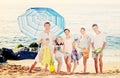 Large family standing together on beach on summer day Royalty Free Stock Photo