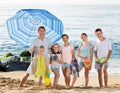 Large family standing together on beach on summer day Royalty Free Stock Photo