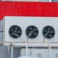 Large fans on the wall of the building
