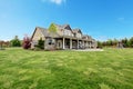 Large farm country house with spring green landscape. Royalty Free Stock Photo