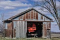 Large Farm Tractor Inside Rustic Shed