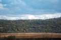 Large farmland hills green blue sky cloudy autumn agriculture farm land landscape clean sharp rural scene Royalty Free Stock Photo