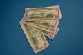 Large Fat Money Roll Isolated on a blue Background Royalty Free Stock Photo