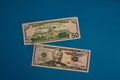 Large Fat Money Roll Isolated on a blue Background Royalty Free Stock Photo