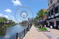 large ferris wheel next to a tall building Royalty Free Stock Photo