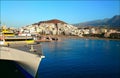 Large ferry on the background of the sea and the city lying on a hill