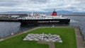 Large ferry boat traversing a harbor on a cloudy day in Ardrossan Marina, Scotland