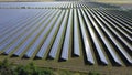 Large field of solar panels under the open sunny sky. Power plant, solar energy. Royalty Free Stock Photo