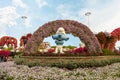 Large figure of one of the Smurfs characters in botanical Dubai Miracle Garden with different floral fairy-tale themes in Dubai