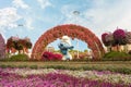 Large figure of one of the Smurfs characters in botanical Dubai Miracle Garden with different floral fairy-tale themes in Dubai