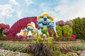 Large figure of one of the Smurfs characters in botanical Dubai Miracle Garden with different floral fairy-tale themes in Dubai