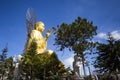 A large figure of a seated golden buddha