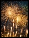 Large firework display in night sky, with multiple fireworks exploding and lighting up dark background. There are at Royalty Free Stock Photo