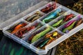 A large fisherman`s tackle box fully stocked with lures and gear for fishing.fishing lures and accessories in the box background Royalty Free Stock Photo