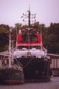 Large fishing boat peacefully docked in a tranquil body of water. Royalty Free Stock Photo