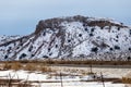 Large flattop mountain covered in snow on overcast day Royalty Free Stock Photo