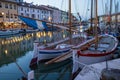Large fleet of colorful boats docked in the calm waters of Cessenatico old town in Italy, Europe