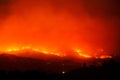 Large forest wildfire at night