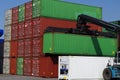 Large forklift stacking containers in port Royalty Free Stock Photo