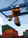 Large forklift stacking containers in port Royalty Free Stock Photo