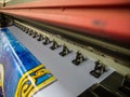 Large format printing machine in operation. Royalty Free Stock Photo