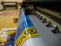 Large format printing machine in operation. Royalty Free Stock Photo