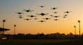 Silhouette of a drone fleet hovering over a field Royalty Free Stock Photo