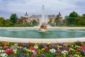Large fountain in the gardens of the royal palace of Aranjuez with flowers of many colors. Madrid Royalty Free Stock Photo