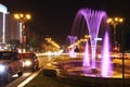 Large fountains installation in the center of Bucharest. Purple water jets. Impressive street show at night