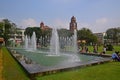 Large fountain pool in Maha Bandula Garden with former High Court Building Royalty Free Stock Photo